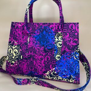 Exquisite purple Ankara bag with flowers